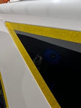Close view of protective masking around the AMG GLE53 trim