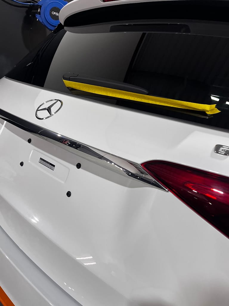 Rear trim and window edges taped before polishing the Mercedes-AMG GLE53