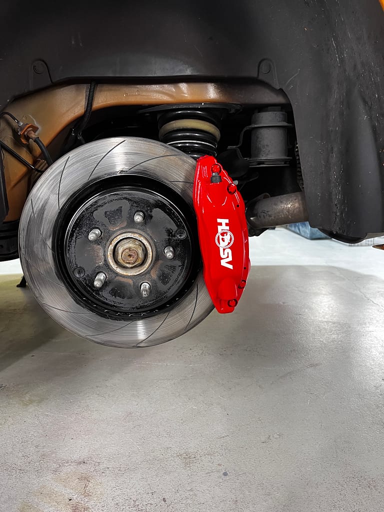 Finished red rear brake caliper on an HSV E2 Maloo
