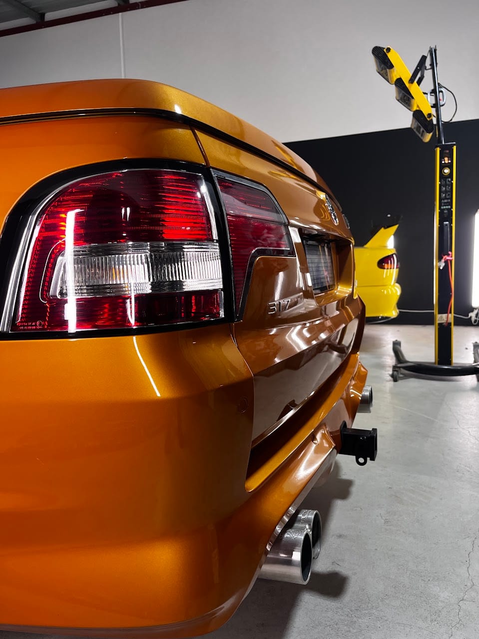 Black VF HSV Clubsport undergoing wheel and caliper preservation at AutoFX WA
